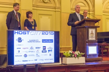 Sir Craig Reedie addressing Host City delegates at the Glasgow City Chambers in November 2015 (L-R: John F MacLeod, Lord Dean of Guild of the Merchants House of Glasgow; The Rt Hon The Lord Provost of Glasgow, Councillor Sadie Docherty; Sir Craig Reedie; Cavendish Group Chairman, Koos Tesselaar
