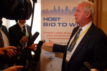 Sir Craig Reedie speaking to international media at the inaugural HOST CITY conference in October 2014