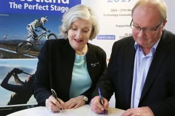 Leanne Coddington and Paul Bush signing the MOU at Host City 2019 (Photo Copyright: David Cheskin)