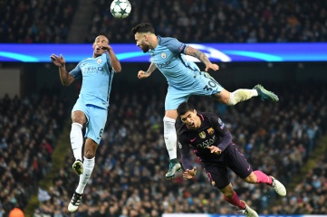 Fernando, Nicolas Otamendi and Luis Suarez pictured during the UEFA Champions League Group C game between Manchester City and FC Barcelona at Etihad Stadium in November 2016 (Photo: CosminIftode / Shutterstock.com)
